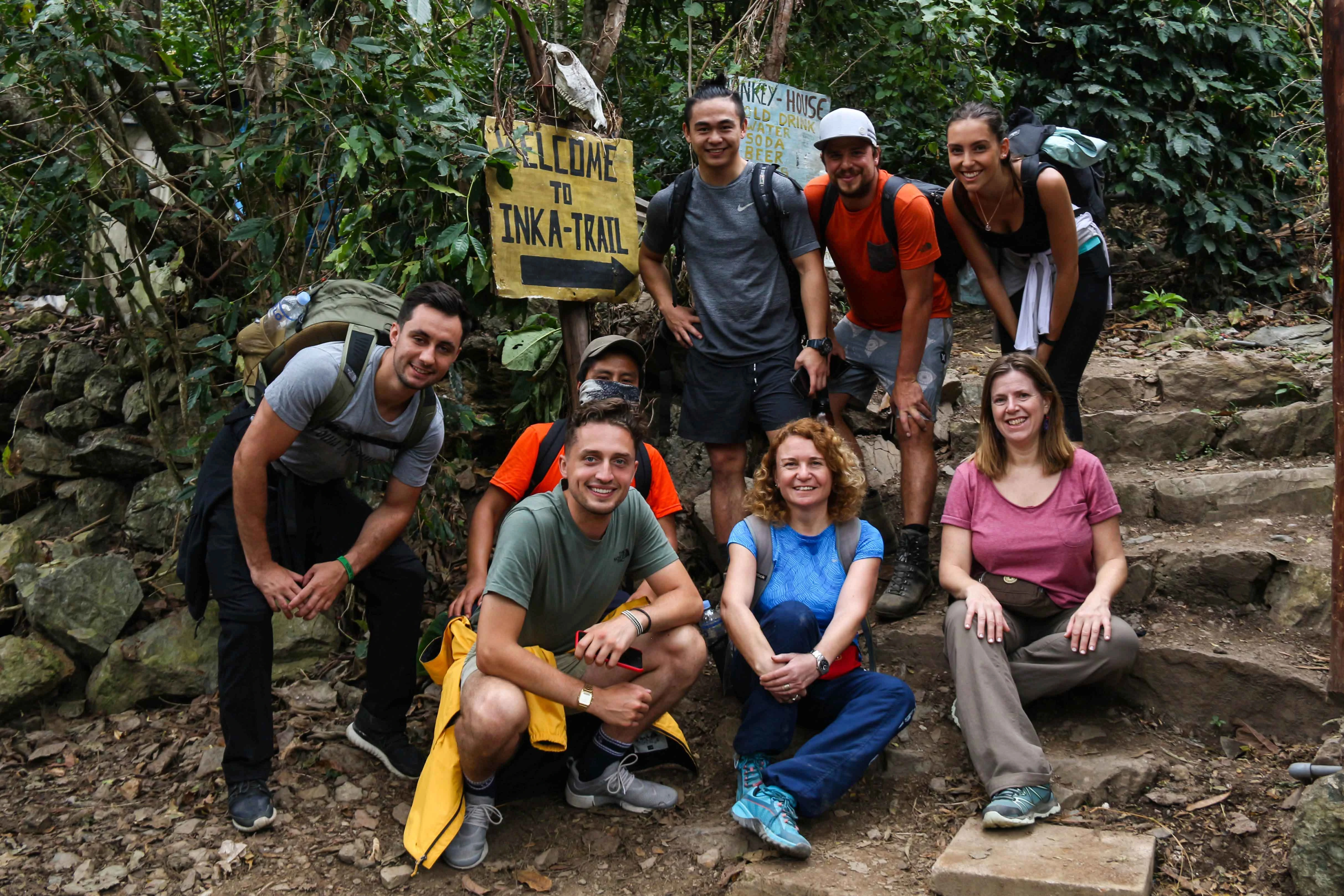  Tourists on the Inca Trail walking through nature and Inca heritage | Conde Travel Adventures