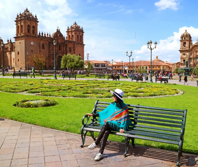 Traveler exploring the historic Cathedral of Cusco at the Plaza de Armas in Peru | Conde Travel Adventures