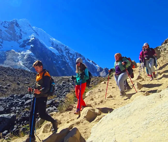 Hikers descending Abra Salkantay on the trek to Machu Picchu in the Peruvian Andes | Conde Travel Adventures