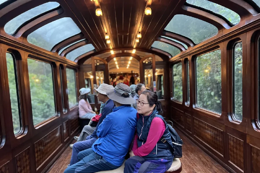 Inside view of the Vistadome panoramic train to Machu Picchu with large windows and scenic landscape | Conde Travel Adventures