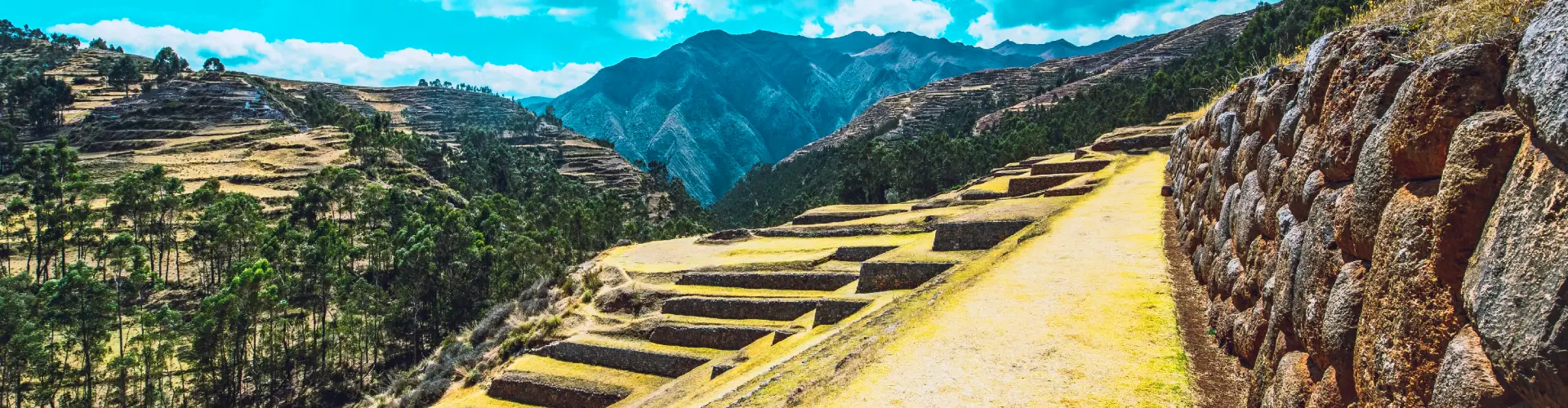 Ancient Inca ruins and terraces at Chinchero Archaeological Site in the Sacred Valley of Peru | Conde Travel Adventures