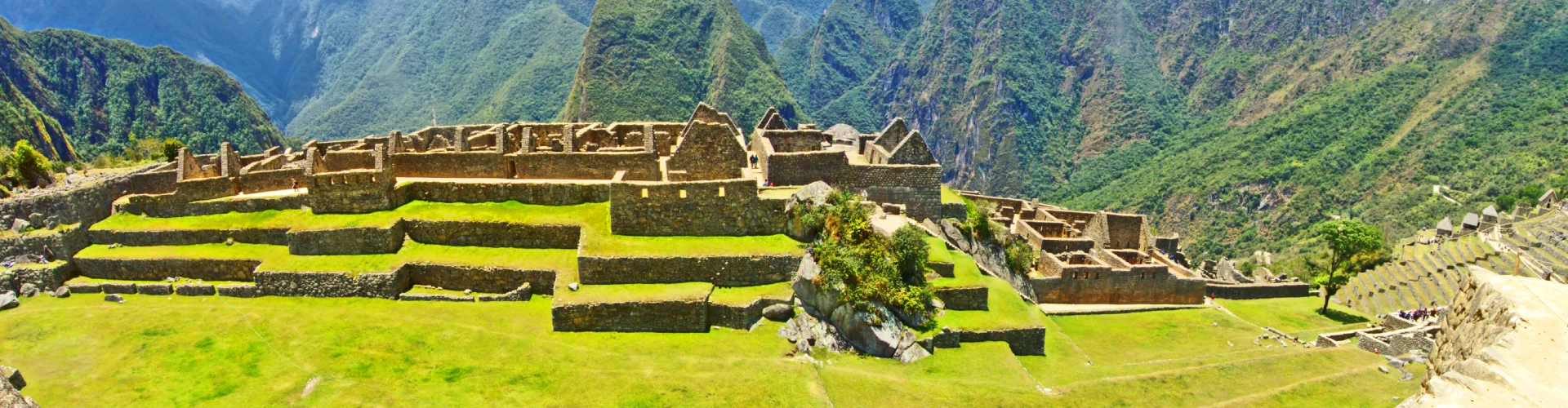 Panoramic view of Machu Picchu with surrounding Andes mountains, iconic Inca citadel in Peru | Conde Travel Adventures