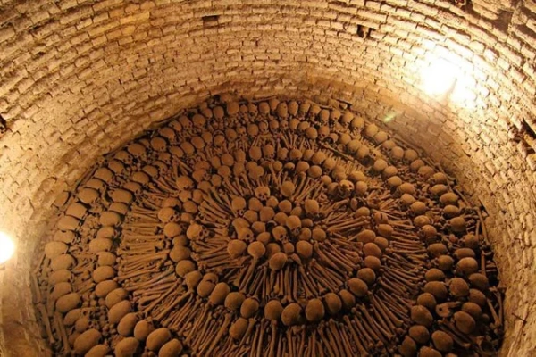 Catacombs of San Francisco in Lima Peru with human bones arranged in geometric patterns