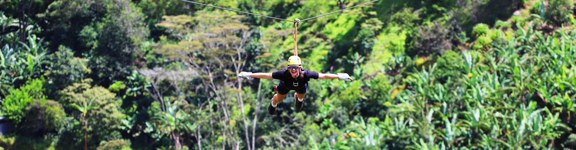 Tourist enjoying an exciting zipline adventure in the Inca Jungle trek near Machu Picchu | Conde Travel Adventures 