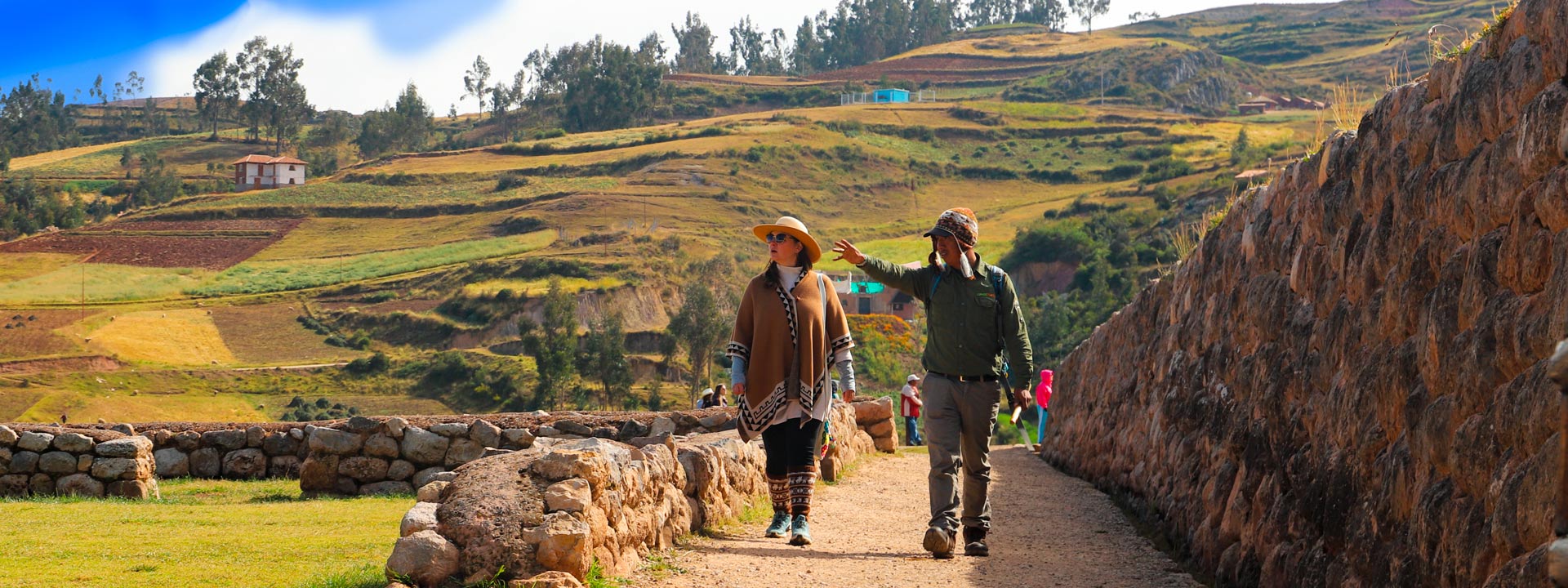 Tourist with a guide at Chinchero archaeological site in Cusco | Conde Travel Adventures