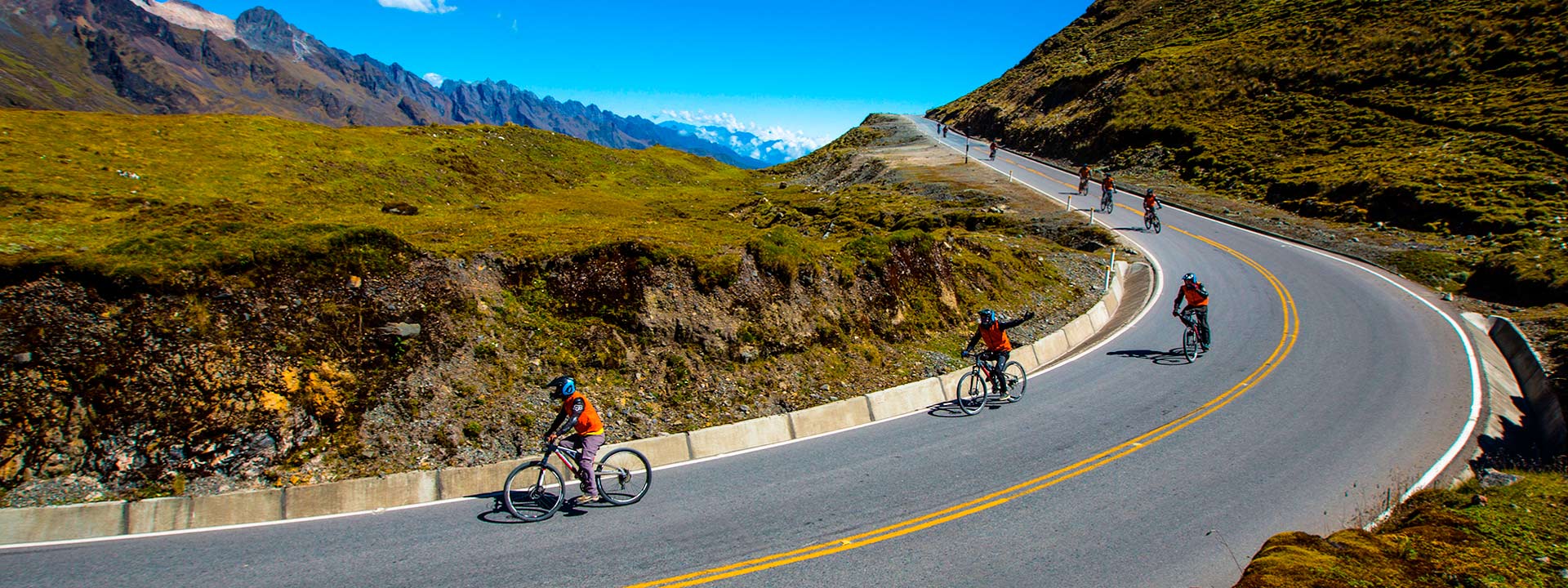 Adventure travelers cycling downhill in the Inca Jungle route to Machu Picchu | Conde Travel Adventures