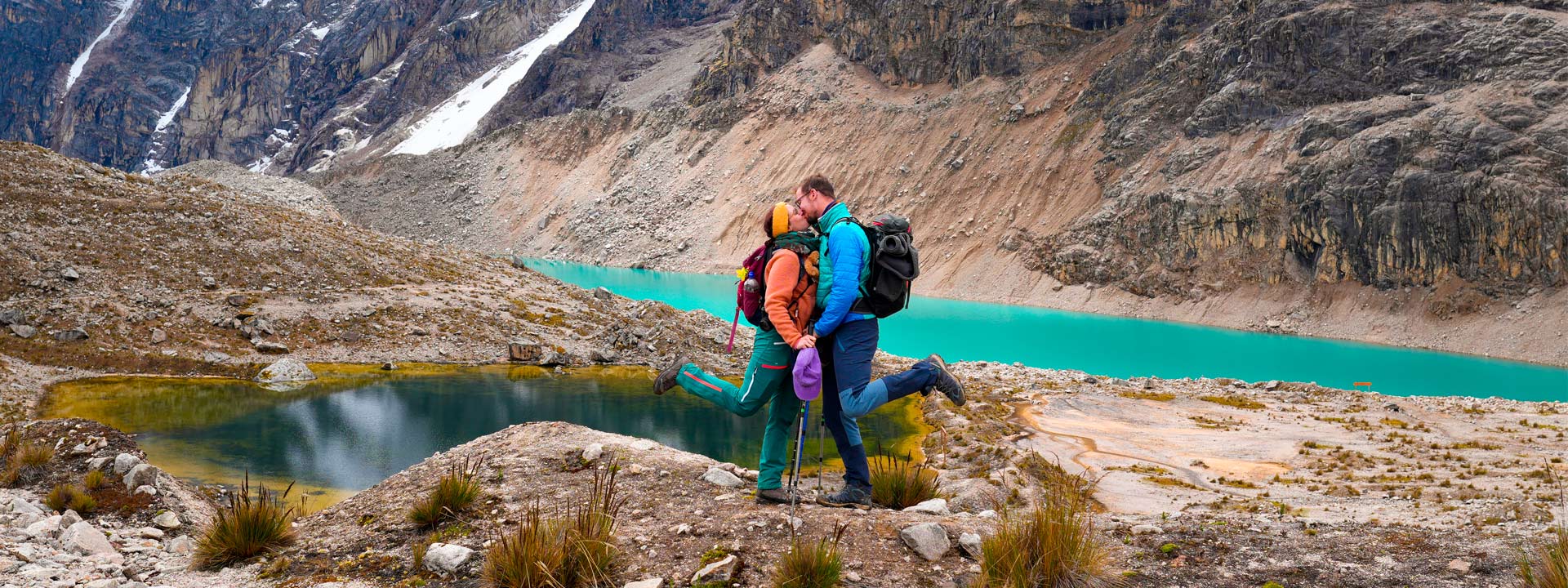 Romantic couple hiking together on the Salkantay trek to Machu Picchu | Conde Travel Adventures