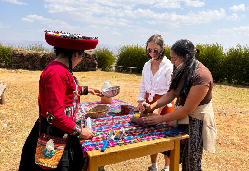 Travelers enjoying an authentic cultural experience during a Luxury Sacred Valley Tour