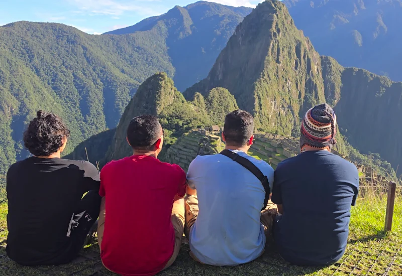 Travelers enjoying panoramic views of Machu Picchu during a private tour.